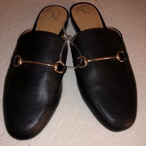 Woman’s black mules